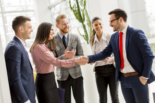 Business partners handshaking after making agreement with employ